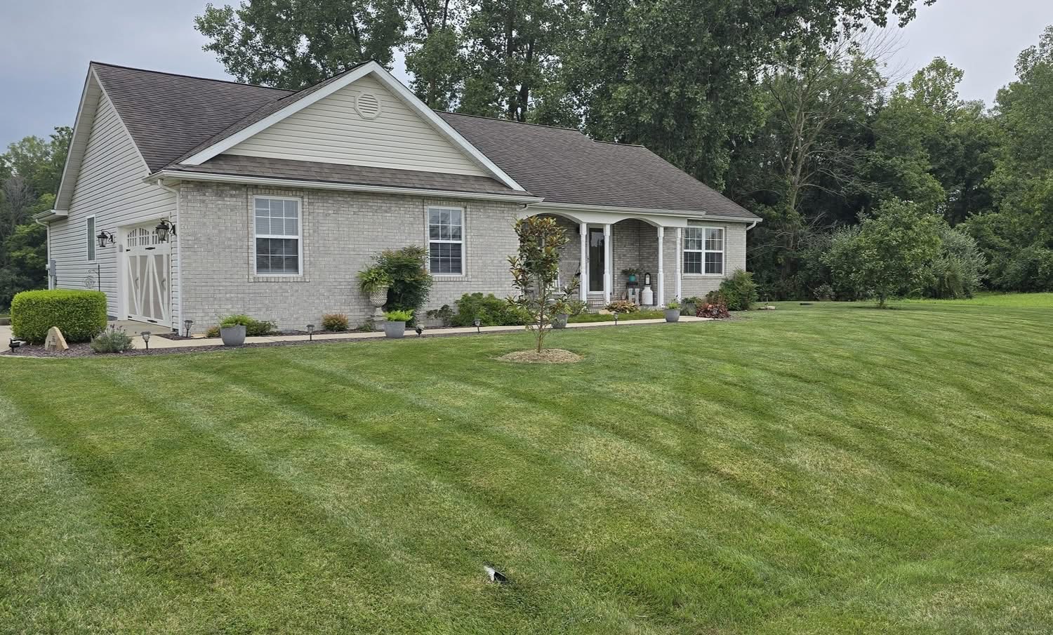 Freshly mowed front lawn with clean stripes